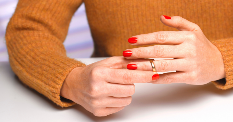 Woman removing her wedding ring