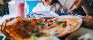 Young girl screaming in a restaurant