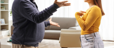father and daughter arguing in living room