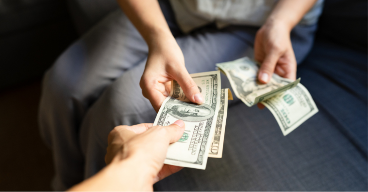 Woman taking money from man