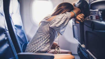 Upset woman on a plane
