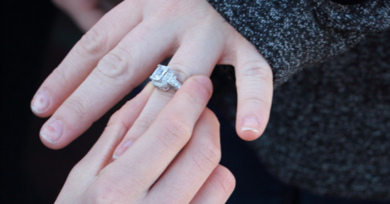 putting engagement ring on finger