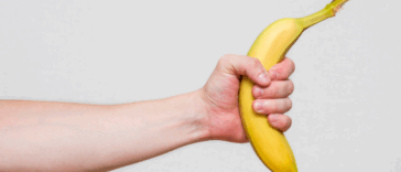A man holding out a bannana