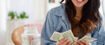 Happy woman counting money
