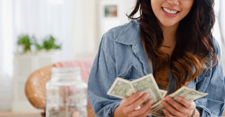 Happy woman counting money