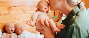 Woman holding a 'reborn' baby doll