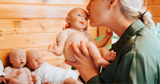 Woman holding a 'reborn' baby doll