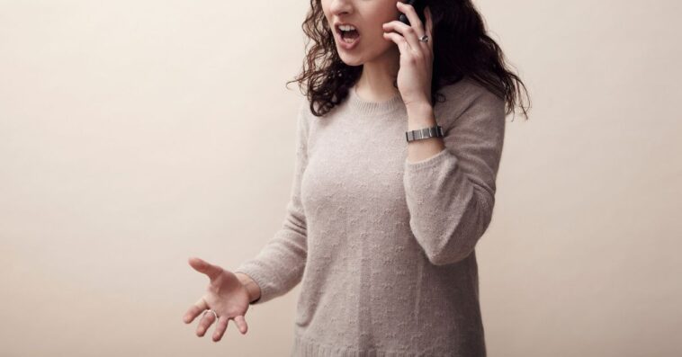 A young woman argues on her cellphone.