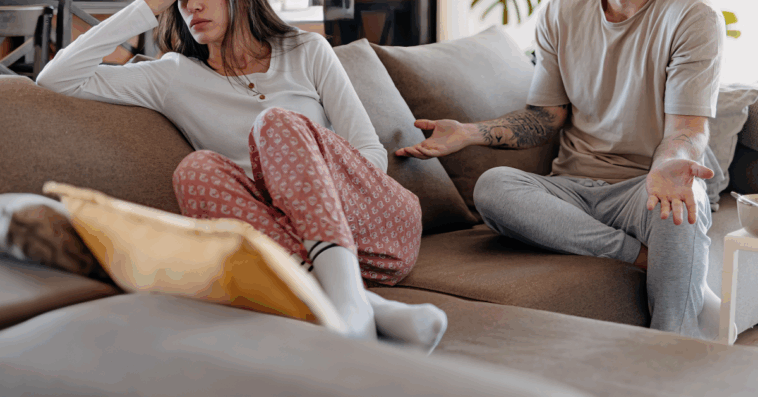 couple on sofa having disagreement
