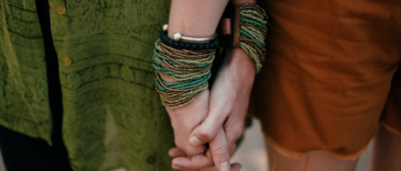 two women holding hands