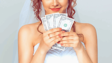 bride holding fanned cash