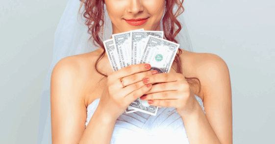 bride holding fanned cash