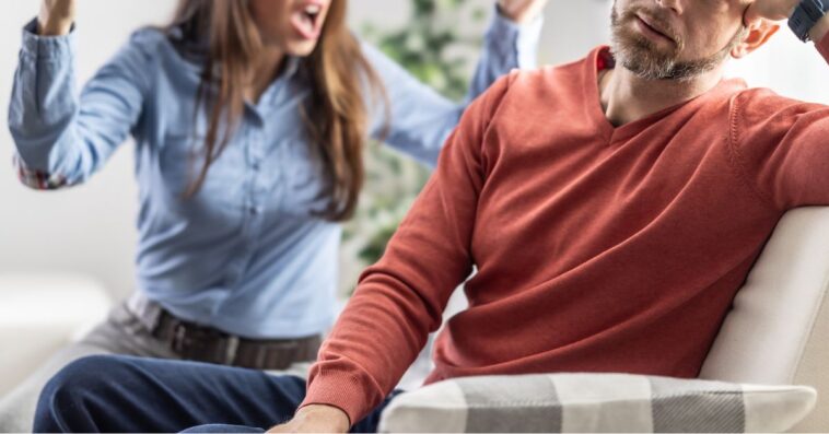 The wife is shouting at her partner who is ignoring her.