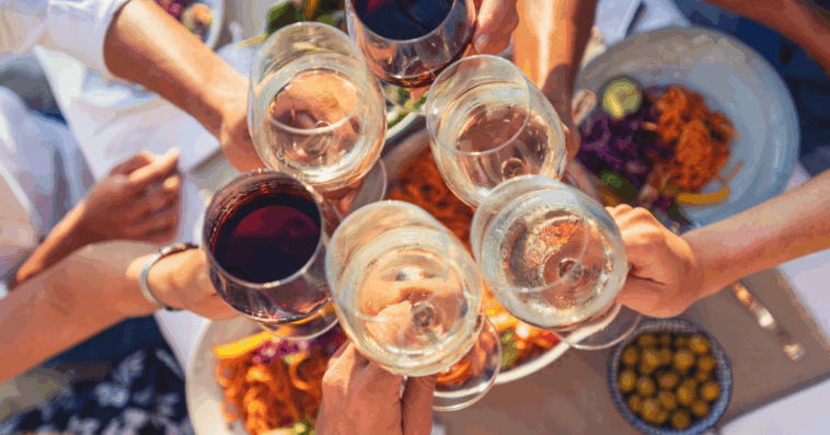 A group of people clinking wine glasses.