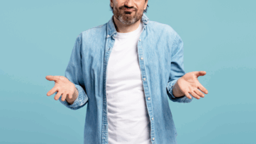 A man shrugging his shoulders and holding out his hands.