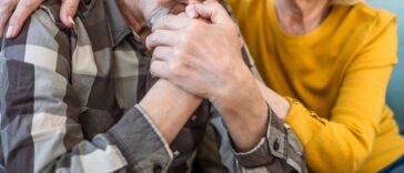 Senior wife expresses empathy and compassion to her sad husband.