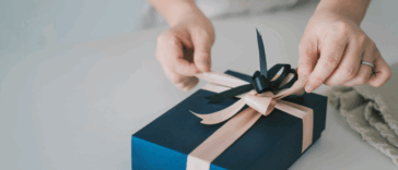A woman wrapping a present.