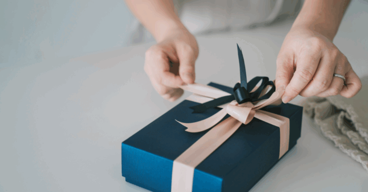 A woman wrapping a present.