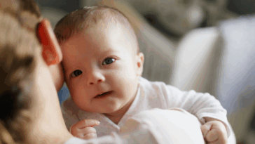 mother holding baby