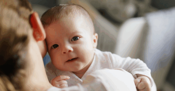 mother holding baby