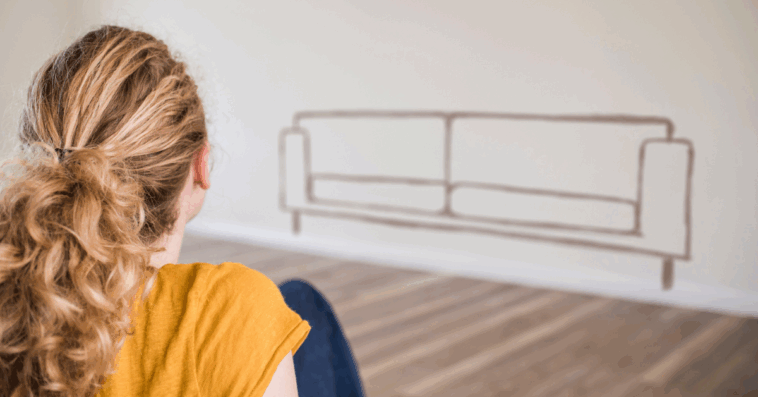 woman looking at silhouette of couch on the wall