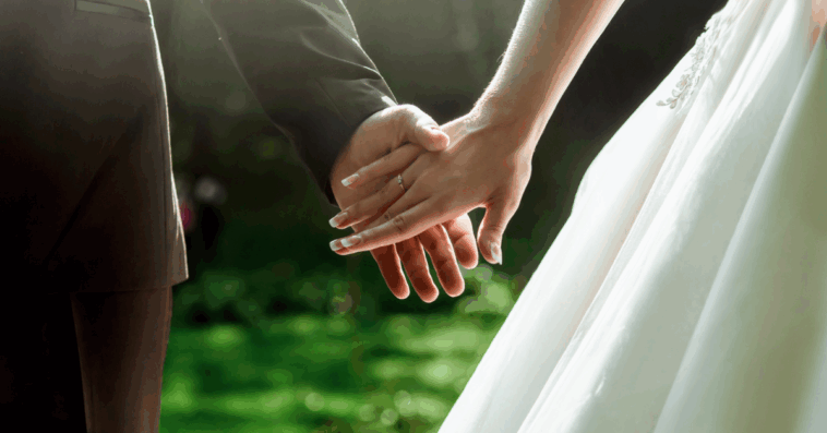 bride and groom holding hands