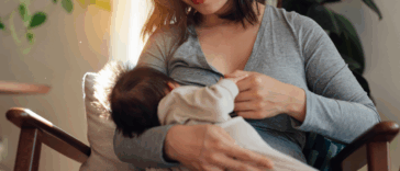 A woman breastfeeding her baby.