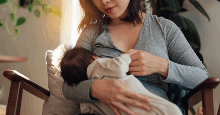 A woman breastfeeding her baby.
