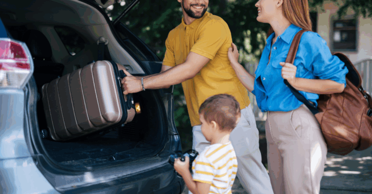 family loading luggage into vehicle