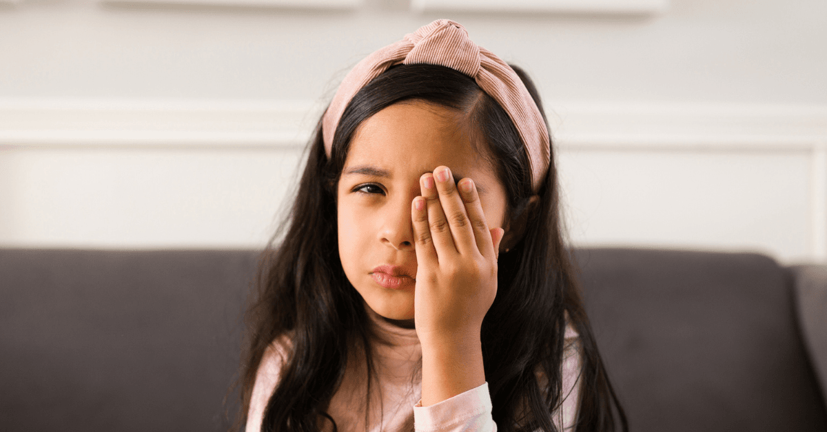 Girl covering her eye