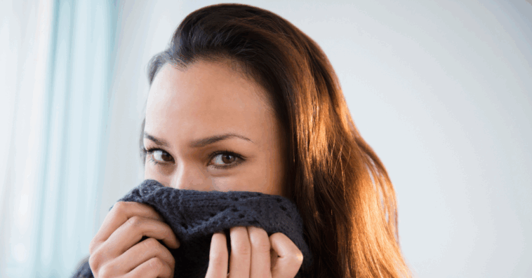 Woman covering her nose