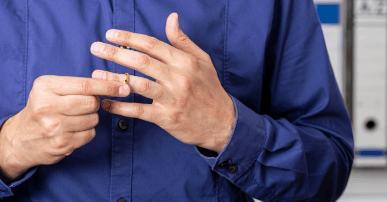 Man taking off his wedding ring