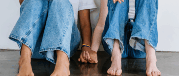 two women holding hands