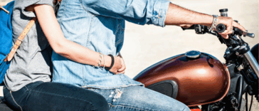 Woman on motorcycle with man