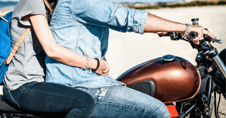 Woman on motorcycle with man