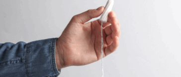 Guy holding a tampon