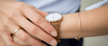 A woman looking at her watch.