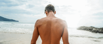back of attractive man on a beach