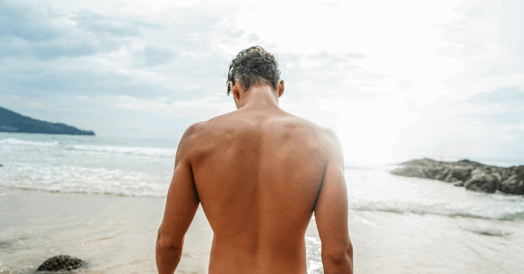 back of attractive man on a beach