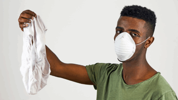 Disgusted guy holding up underwear