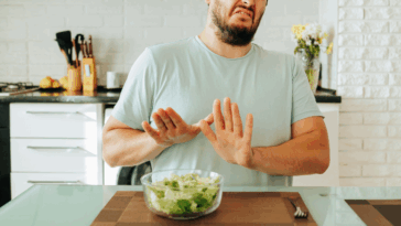 man reaction to bowl of vegetables