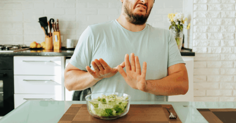 man reaction to bowl of vegetables