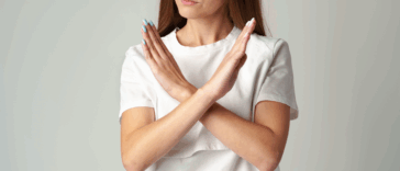 A woman with her arms crossed in front of her.