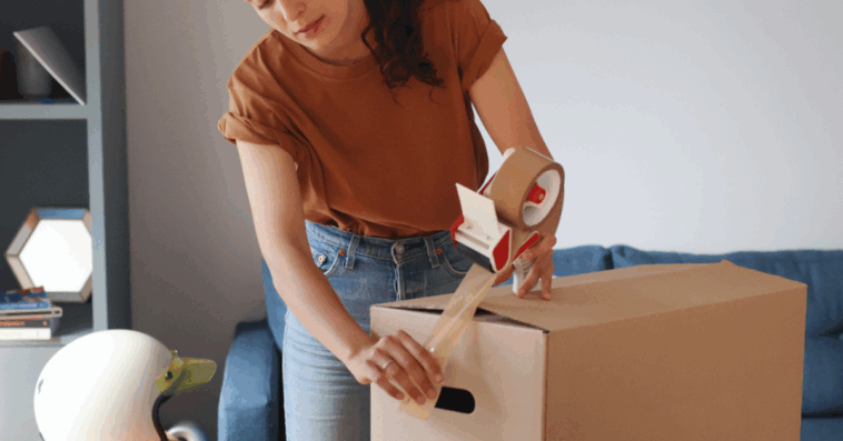Woman packing boxes