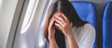 Woman upset on a plane
