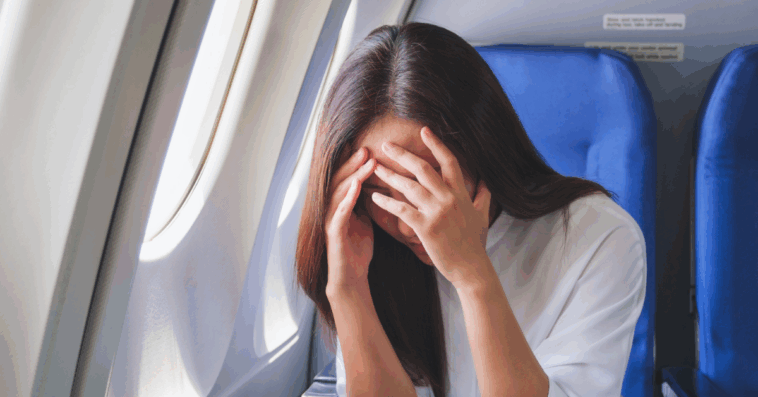 Woman upset on a plane