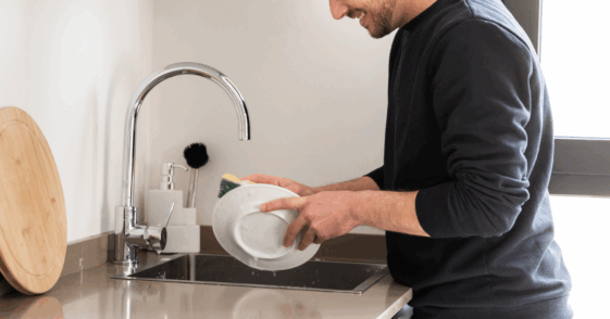Guy washing dishes