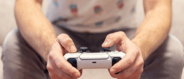 A man holding a video game controller.