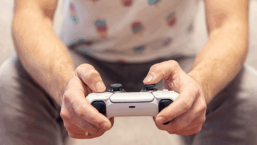 A man holding a video game controller.