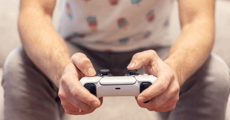 A man holding a video game controller.